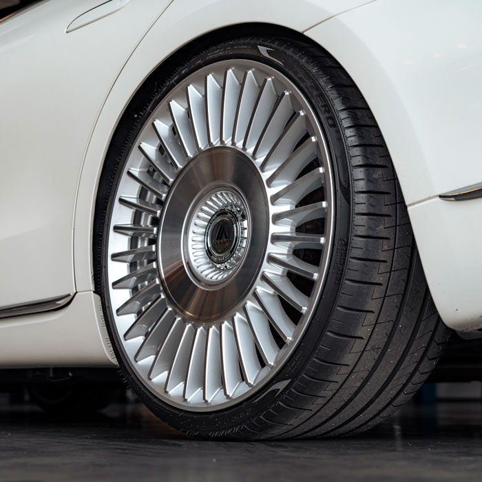 closeup of silver rim with lots of spokes