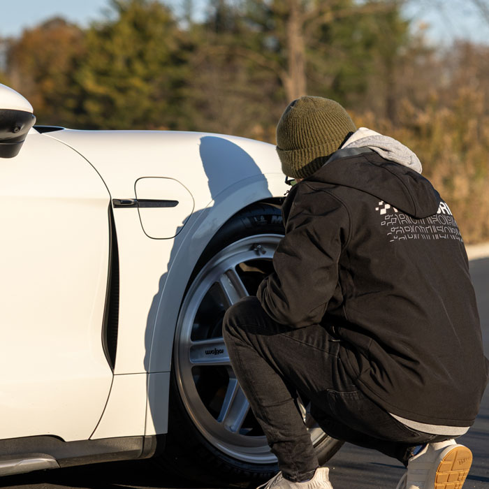 man working on car tire